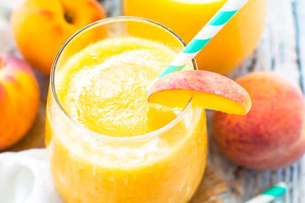 Frozen sangria recipe made with peaches for an easy summer drink.