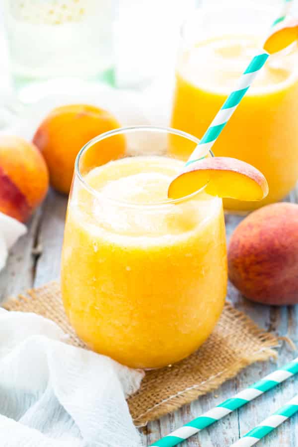 Gluten-free Frozen White Wine Sangria made with peaches on a table for a healthy summer drink.