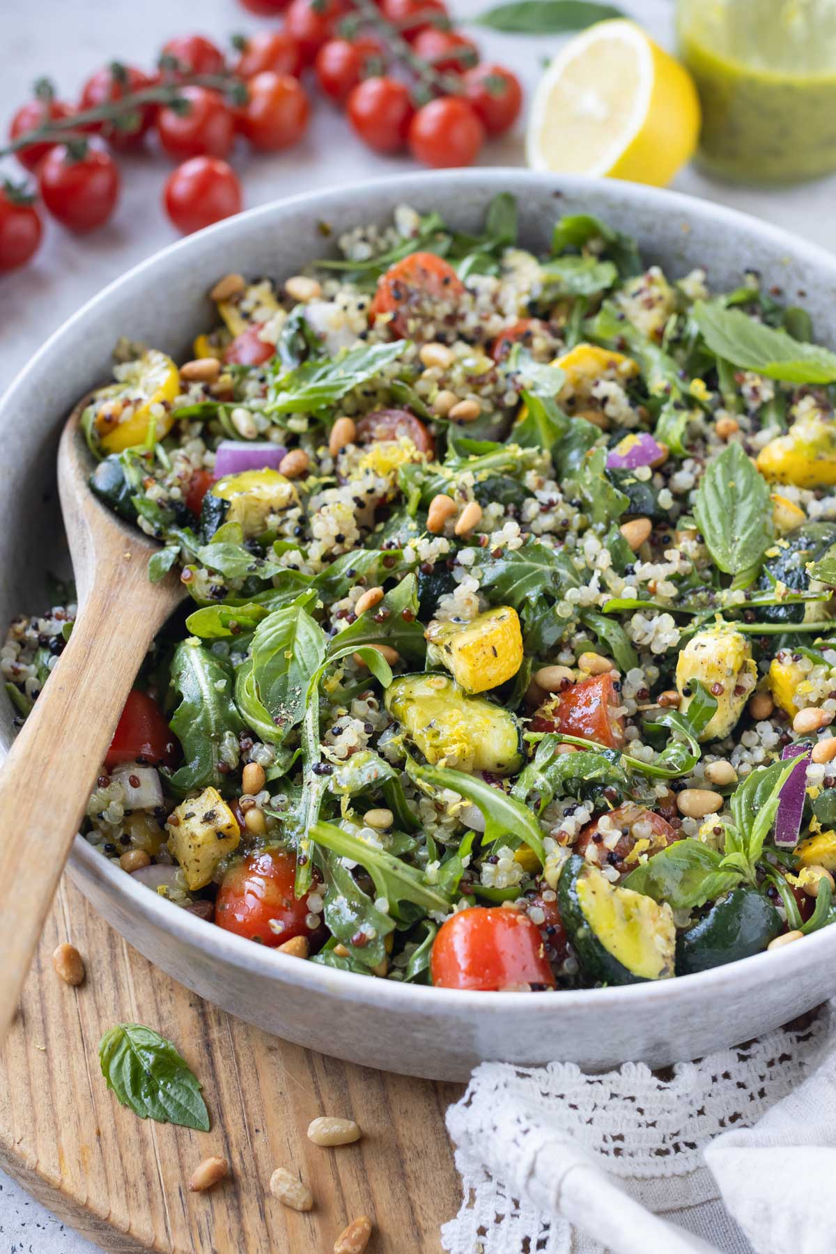 A lemony roasted summer squash quinoa salad is served.