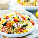 Gluten-free quinoa salad dressing with a summer vegetable quinoa salad for a healthy lunch.