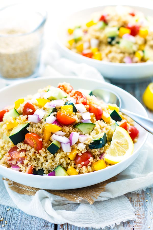 Gluten-free quinoa salad dressing with a summer vegetable quinoa salad for a healthy lunch.