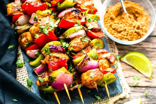 Grilled Fajita Chicken Kabobs with seasoning on the side for a quick dinner.
