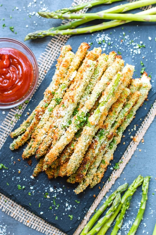 A stack of a baked parmesan asparagus recipe for a healthy snack.
