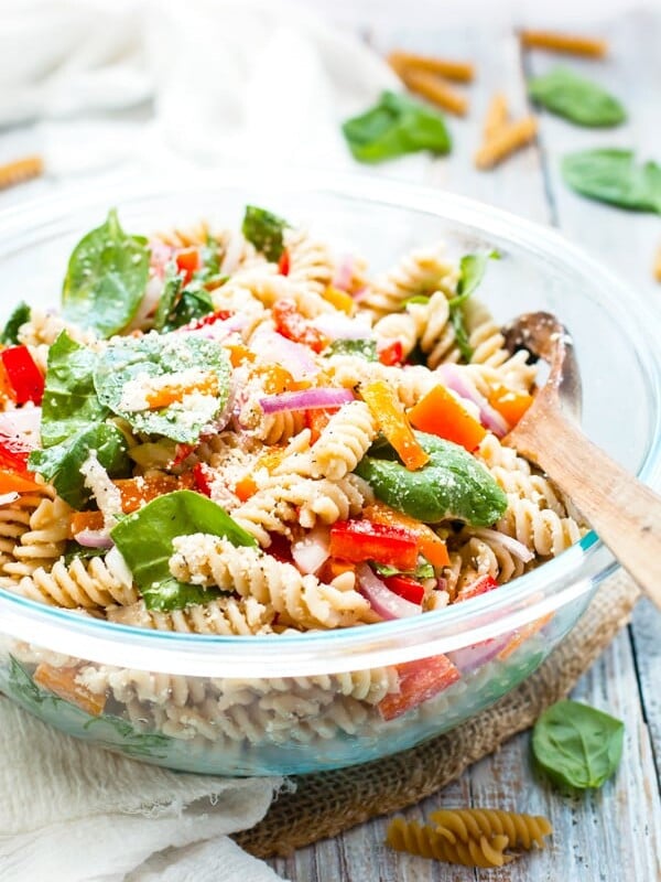 Italian Dressing Pasta Salad made with Parmesan Cheese in a serving bowl on a white napkin.