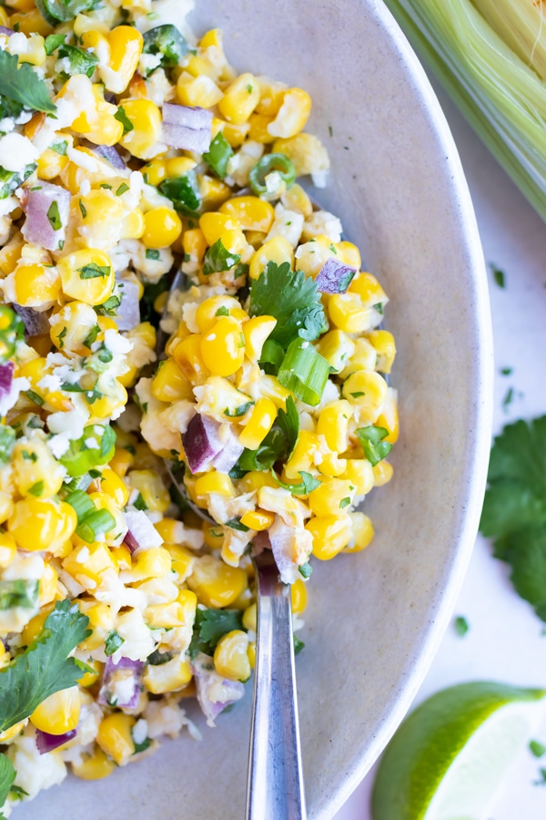 An easy corn salad recipe with Mexican cuisine ingredients and fresh lime juice.