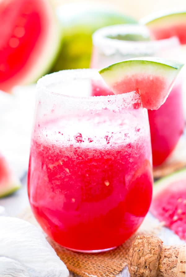 One glass of gluten-free watermelon cocktail made with Tequila and Champagne for a summer party.