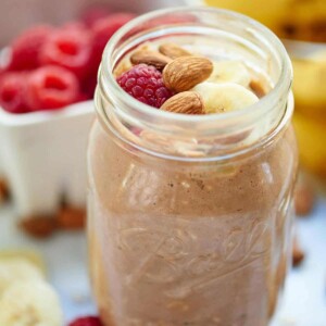 A jar of overnight oats is served with fresh fruit.
