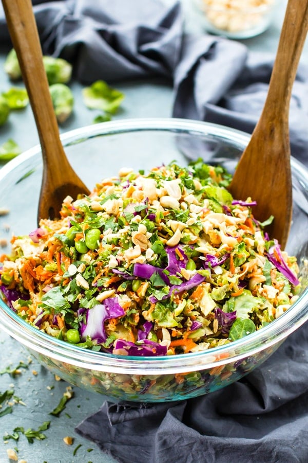 Brussels Sprout Salad in a serving bowl with wooden forks.