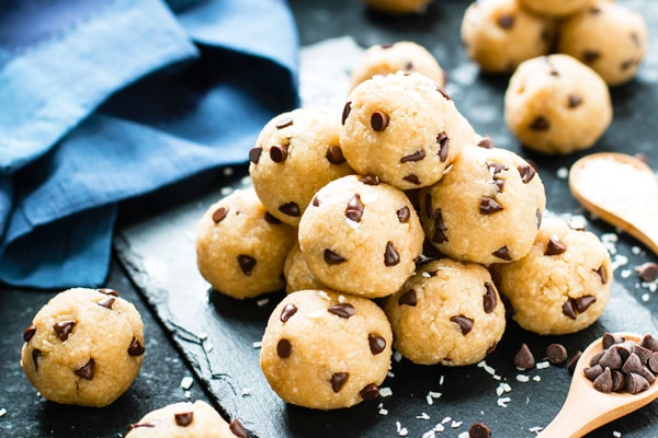 A stack of gluten-free cookie dough bites made with chocolate chips for a healthy treat.