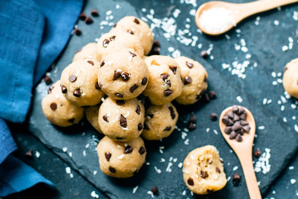 A pile of a healthy cookie dough balls recipe with chocolate chips ready for dessert.