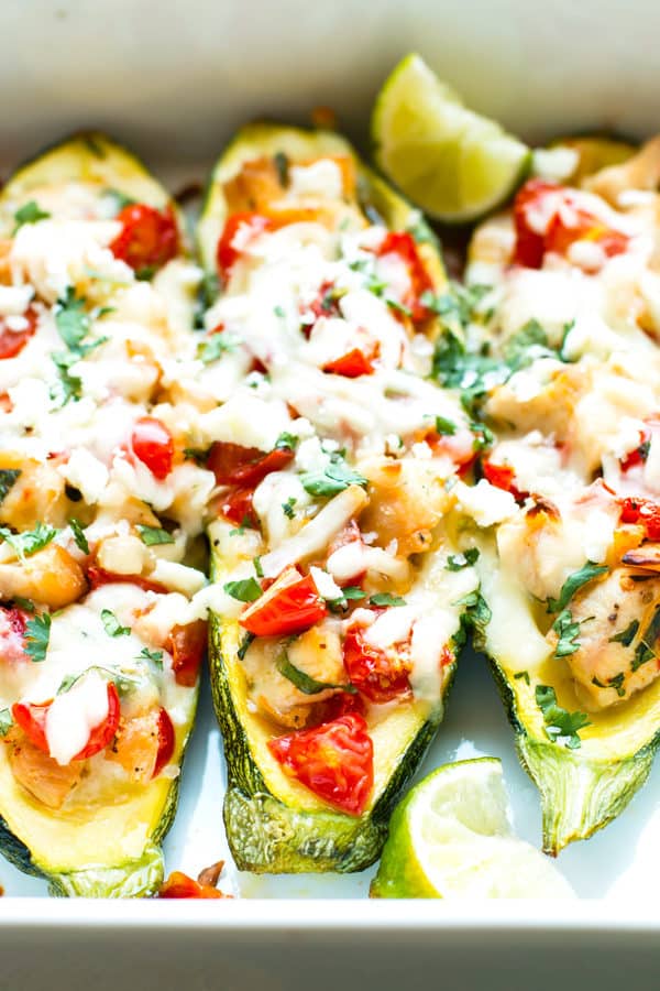 Zucchini boats stuffed with gluten-free cilantro lime chicken for a healthy meal.
