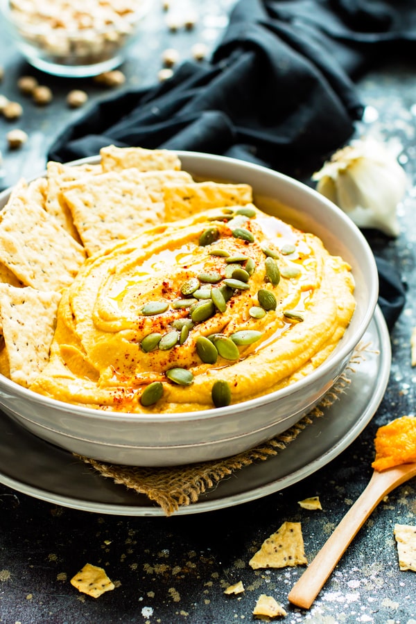 Savory pumpkin recipes start with this pumpkin hummus in a serving bowl.