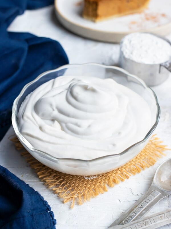 A clear bowl full of vegan coconut whipping cream.