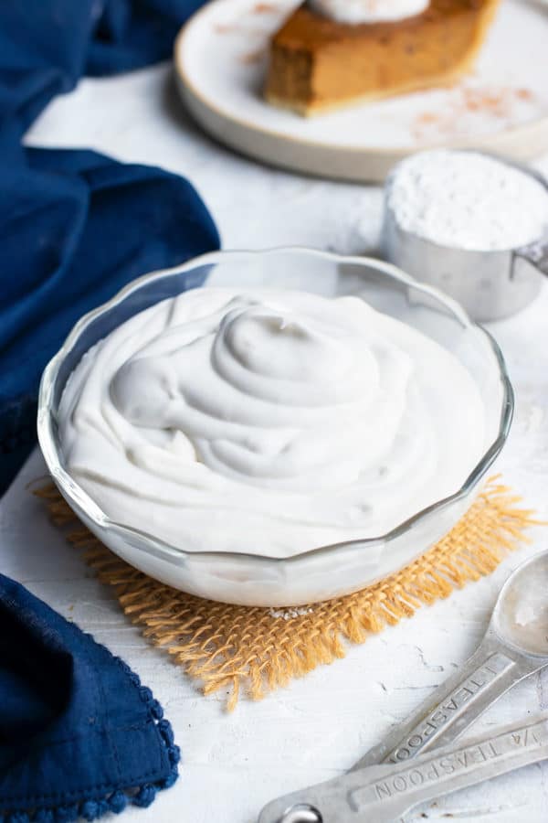 A clear bowl full of vegan coconut whipping cream.