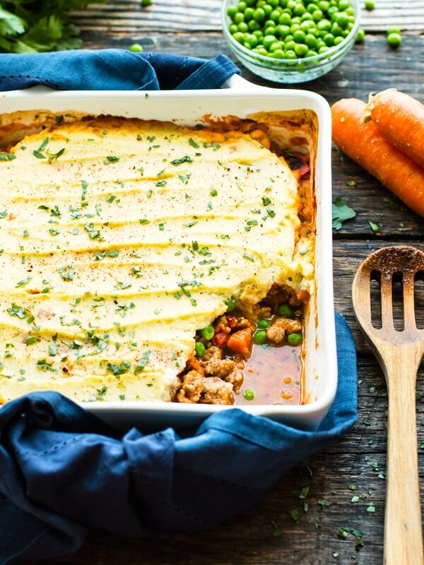 Paleo Ground Turkey Shepherd's Pie with carrots and peas in a casserole dish.
