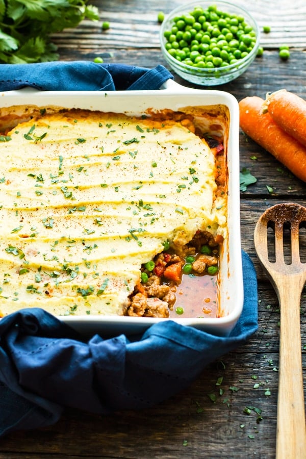 Paleo Ground Turkey Shepherd's Pie with carrots and peas in a casserole dish.