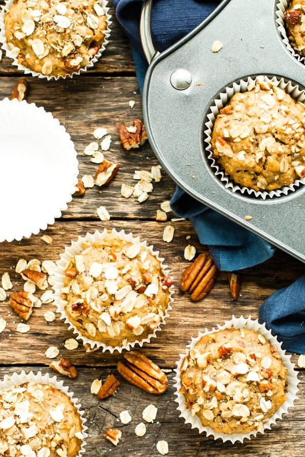 Gluten-free muffins recipe with maple and pecan on a wood table for a healthy breakfast.