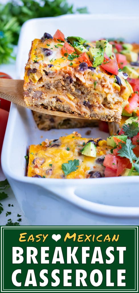 Mexican breakfast casserole is served with a wooden spoon.
