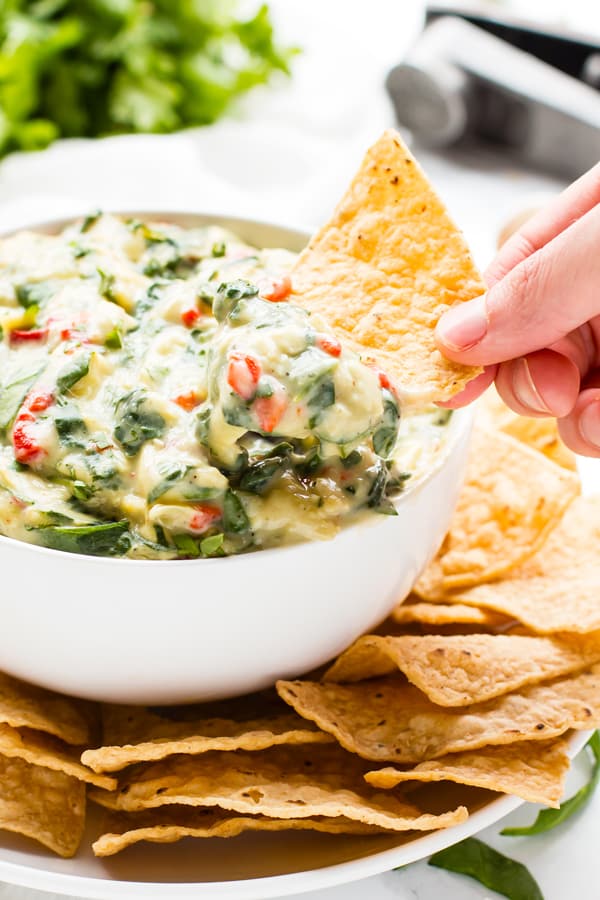 Dairy-Free Vegan Spinach Artichoke Dip | Dairy-free vegan spinach artichoke dip recipe is always a crowd-pleaser at Christmas, New Years or Super Bowl parties.  Enjoy much of this healthy spinach artichoke dip recipe as you want without worrying about your tummy getting upset!  