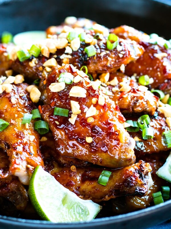 Baked Thai chicken wings with a sweet and spicy flavor in a black bowl.