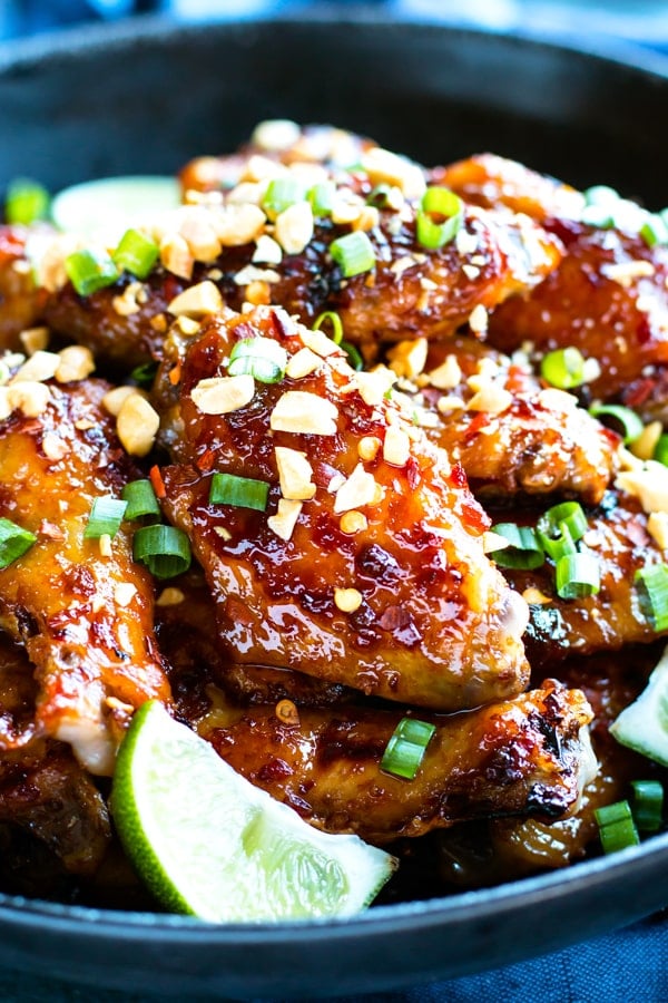 Perfectly sticky, sweet and a bit spicy, baked Thai chicken wings will be a new game day recipe favorite in your house!  This easy chicken wings recipe is oven-baked, low-carb, refined sugar-free, gluten-free, dairy-free, and absolutely addicting!