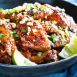 Gluten-free Thai wings recipe in a black bowl for an easy dinner.