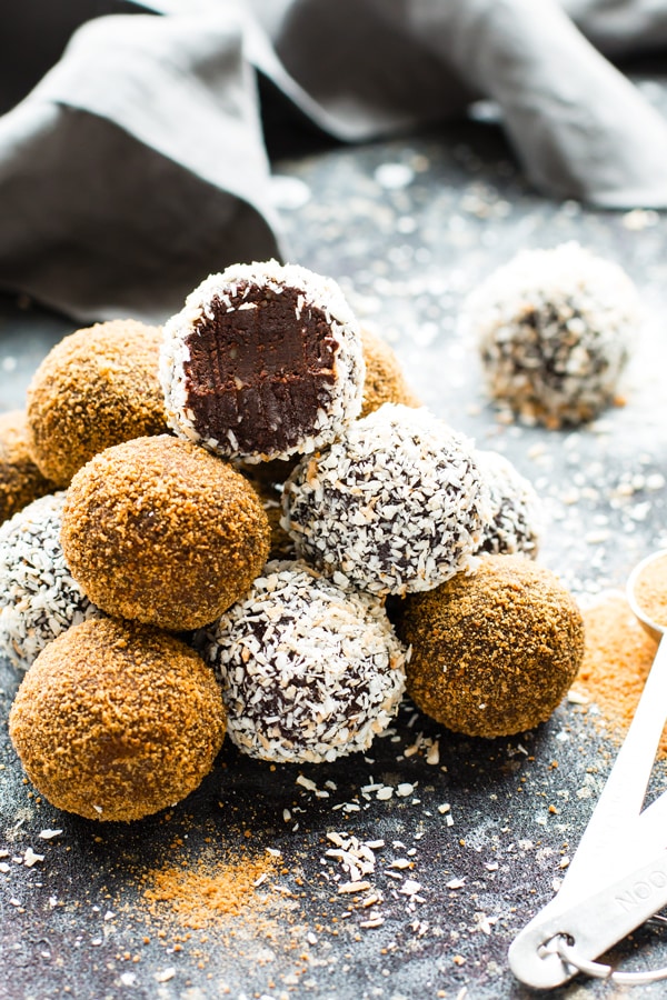 Paleo Chocolate Fudge Truffles are made with coconut milk and almond butter for a super creamy and ultra-fudgy grain-free, gluten-free, and vegan dessert recipe!  A healthy fudge recipe that is great for an afternoon snack or kid-friendly dessert.