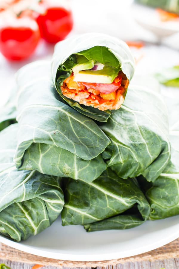 A veggie hummus wrap recipe in a pile ready to eat for dinner.
