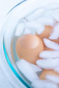 An ice water bath to cool down hard-boiled eggs to make them easy to peel.