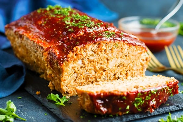 Gluten-free meatloaf with ground turkey on a slab for dinner.