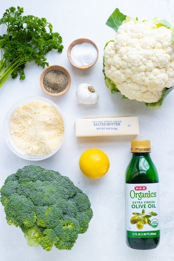 Broccoli, cauliflower, garlic, parsley, lemon zest, parmesan cheese, and butter are the ingredients in this roasted cauliflower and broccoli recipe.