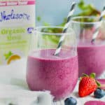 Beet banana smoothie in two glasses with Wholesome Organic Stevia in the background.