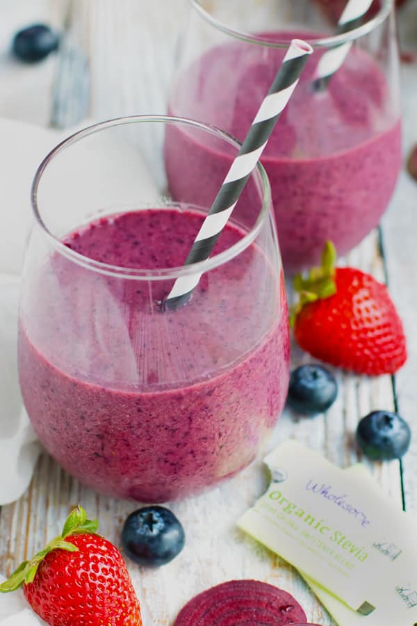 Two glasses of a vegan breakfast smoothie with straws.