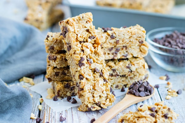 A collection of No Bake Peanut Butter Granola Bars on a table with a blue napkin.