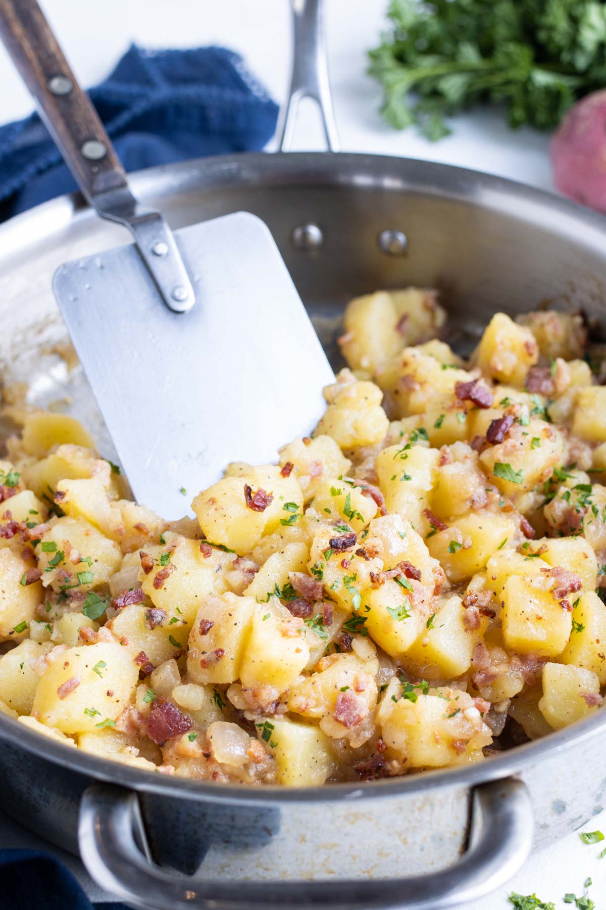 All ingredients are covered in the dressing while on the stove.