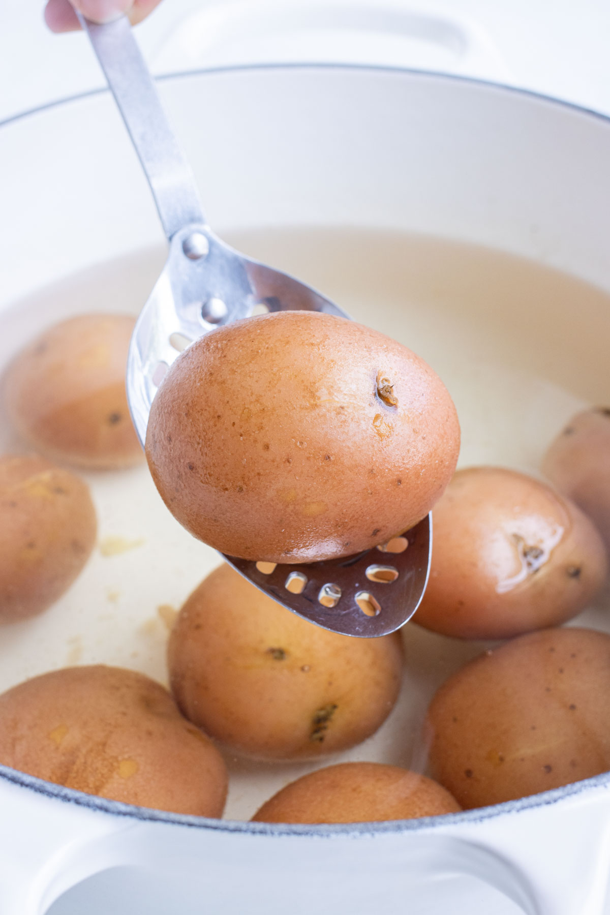 Potatoes are boiled in water until soft.