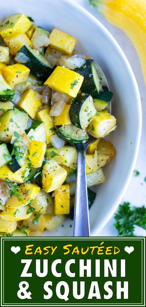 Sautéed zucchini and yellow summer squash in a stainless steel skillet with a spatula.
