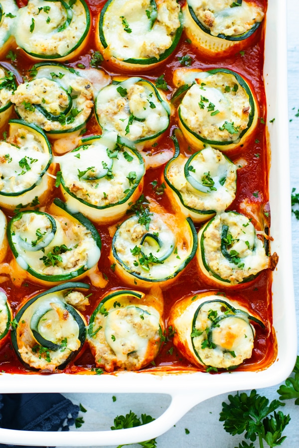 Healthy Zucchini Lasagna Roll-Ups in a white dish for dinner.
