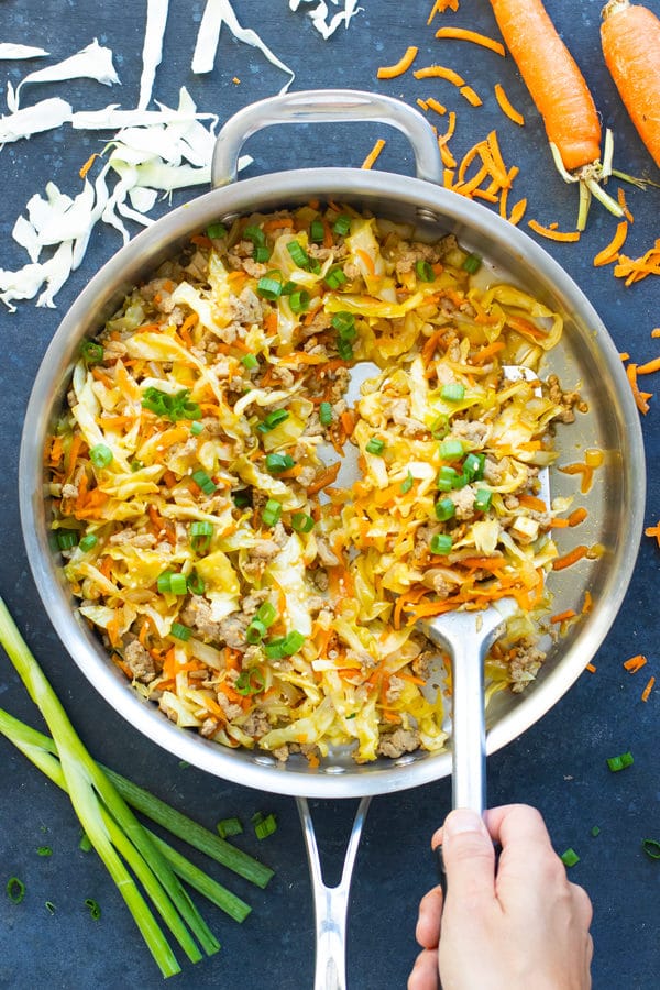 Easy Egg Roll in a Bowl Recipe | This Egg Roll in a Bowl recipe is loaded with flavor and is a Paleo, Whole30, and keto recipe to make for an easy weeknight dinner. From start to finish, you can have this healthy and low-carb dinner recipe ready in under 30 minutes! It's a super easy and healthy ground turkey dinner recipe!
