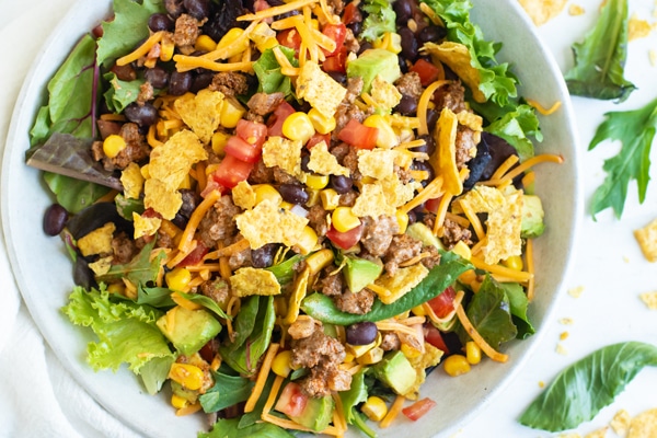 An overhead picture of gluten-free taco salad in a white bowl.
