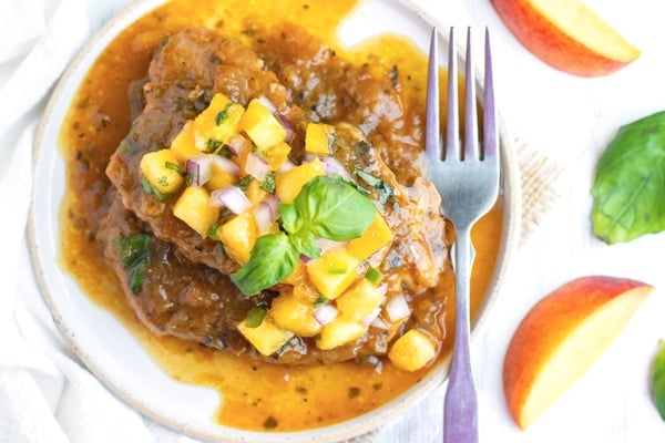 An overhead picture of a gluten-free, Instant Pot pork chops recipe on a white plate.