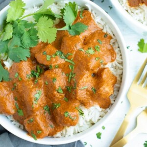 Overhead picture of Chicken Tikka Masala recipe with rice in a white bowl.