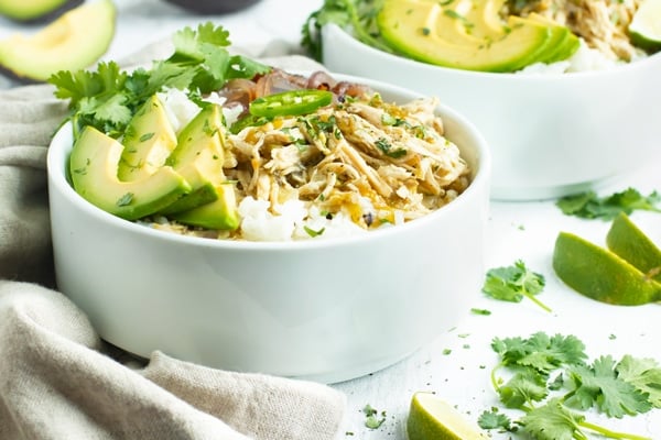 Easy slow cooker Mexican shredded chicken recipe in a white bowl.