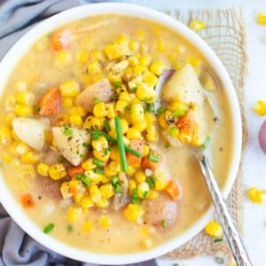 Overhead picture of vegan corn chowder in a white bowl.