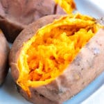 Mashed Instant Pot sweet potato on a white plate.