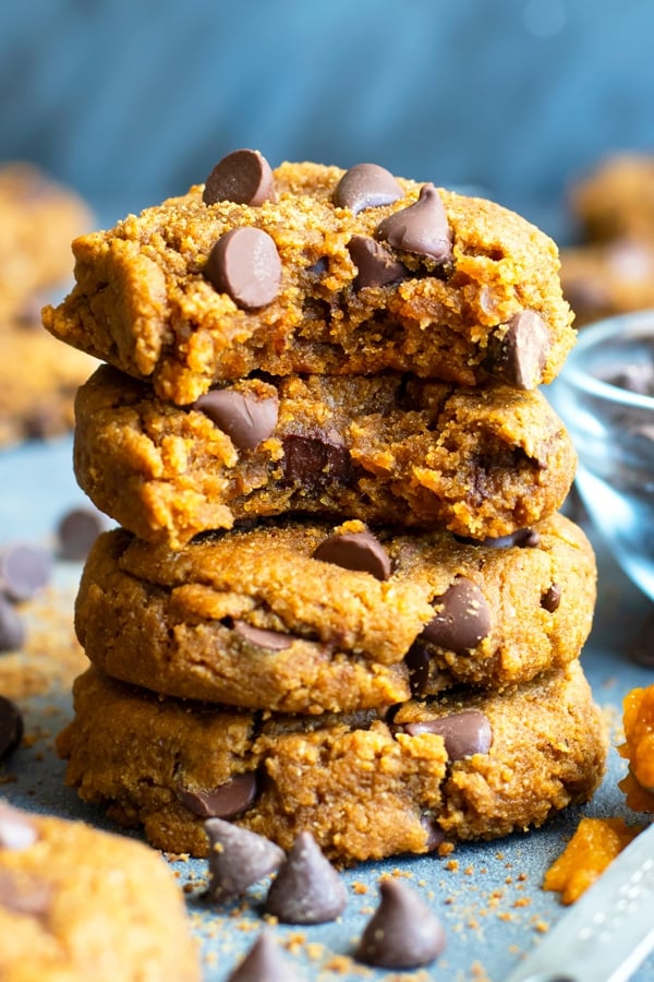 Gluten-free pumpkin cookies in a stack with a bite taken out.