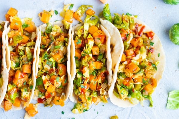 Beautiful picture of Brussel sprout tacos filled Paleo tortillas.