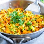 A picture of easy vegetable side dishes which include Skillet Brussel sprouts and sweet potatoes.