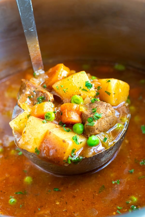 Instant Pot Beef Stew is a healthy, easy, and comforting soup recipe to make in the pressure cooker.  Learn how to make a Whole30, gluten-free and dairy-free pressure cooker beef stew recipe that is full of the most tender beef stew meat and loaded with healthy vegetables!