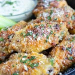 Gluten-free chicken wings with Parmesan and garlic that are baked in the oven until the skin is crispy.